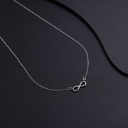 Elegant Silver Necklace Featuring a Stunning Infinity Pendant